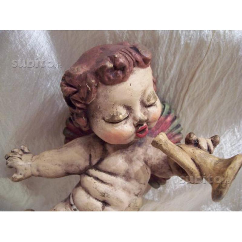 Thun antico putto con tromba capelli rossi